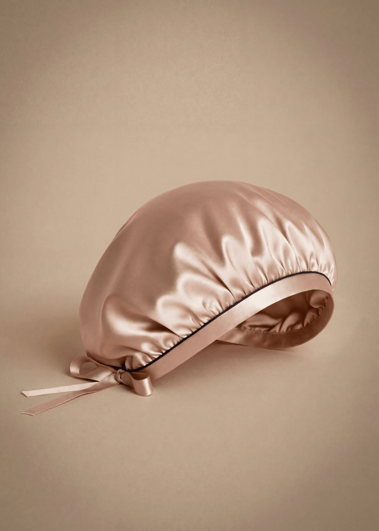 Rose gold silk hair bonnet with midnight blue trim by Miaveriana